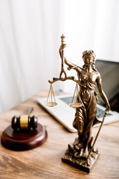 Business and lawyers discussing contract papers with brass scale on desk in office. Law, legal services, advice, justice and law concept picture with film grain effect