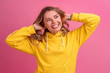 young pretty blonde woman cute face expression posing in yellow hoodie