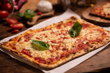 Rectangular shape and thin hand made Margherita pizza