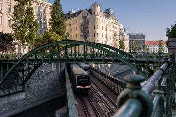 Crédence de cuisine en verre imprimé Vienne Trains running on a bridge over the Danube canal water, Vienna, Austria