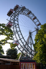The giant Ferris wheel in Prater, the oldest amusement park in the world, against blue sky, Vienna, Austria