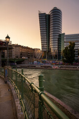 Fototapeta premium View of Uniqa Tower building and Danube canal at sunset, Vienna, Austria