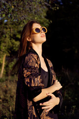 woman wearing sunglasses outdoors posing fashion glamor