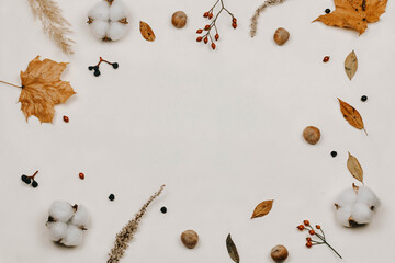 Autumn composition. made of cotton flowers, dried leaves on pastel gray tones. Autumn, fall concept. Flat lounger, top view, copy space