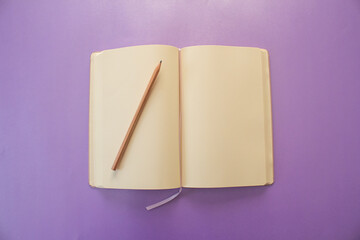 Open notebook with blank pages.