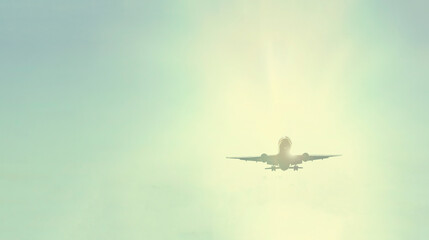 Airplane against the sky with a white bright sun. transport