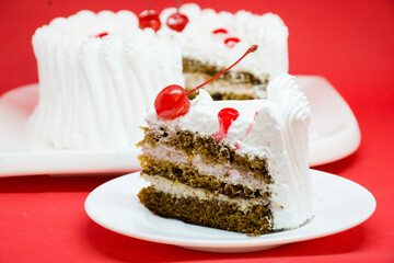 White cake with red cherries