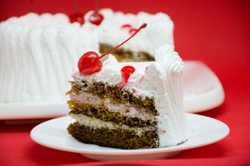 White cake with red cherries