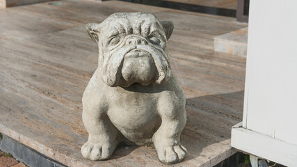 concrete sculpture of a formidable bulldog. The concept of strength, power