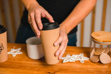 Fototapeta na wymiar coffee cup in men's hands in the new year