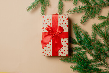 Fototapeta na wymiar Holiday gift box with spruce branches