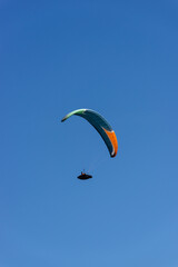 Paragliding Pilot Flying a Paraglider - 468448214