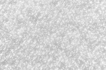 Snowy white background. Close-up snowflakes texture.