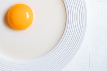 Macro close up of raw egg yolk
