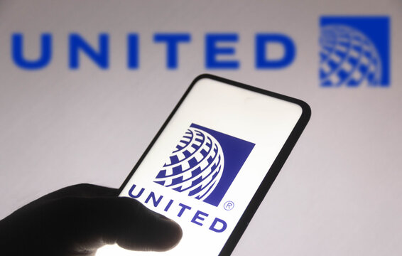 November 10, 2021, Brazil. In this photo illustration the United Airlines logo is seen displayed on a smartphone screen and in the background.