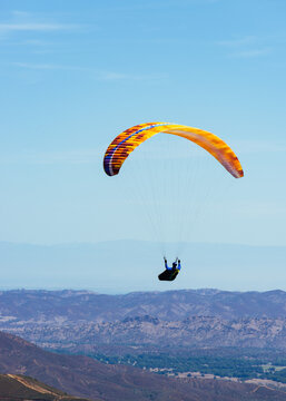 Paragliding Pilot Flying a Paraglider