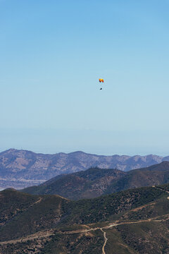 Paragliding Pilot Flying a Paraglider