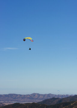 Paragliding Pilot Flying a Paraglider