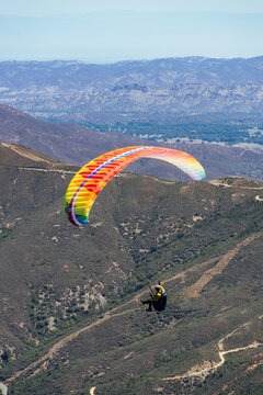 Paragliding Pilot Flying a Paraglider
