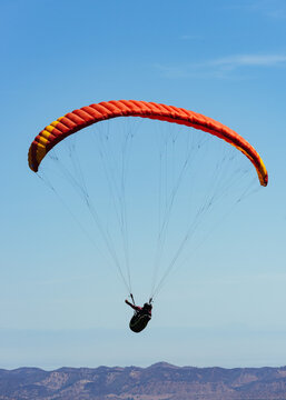 Paragliding Pilot Flying a Paraglider