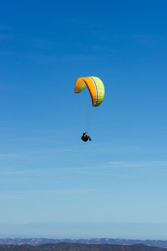 Paragliding Pilot Flying a Paraglider