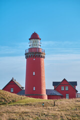 Red lighthouse at the danish coast called Bovbjerg Fyr. High quality photo - obrazy, fototapety, plakaty