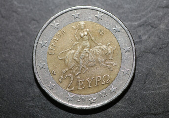 Macro shots of euro coins background 2 Euro coin year of manufacture 2002 country Greece high...