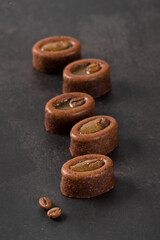 Mini oval coffee muffin in the shape of savarin with filling on a dark background