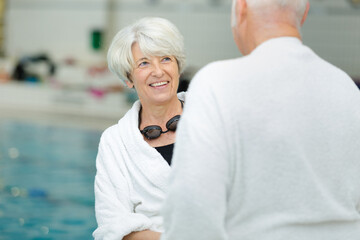 senior couple talking at the swimming baths