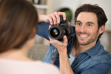 Fototapeta premium photographer and model working in modern lighting studio