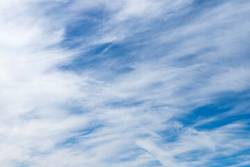 White cirrostratus clouds in blue sky on a daytime
