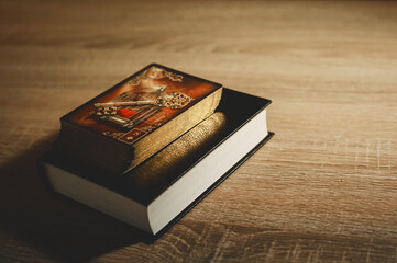 deck of tarot cards, lenormand, book, bible on a wooden table