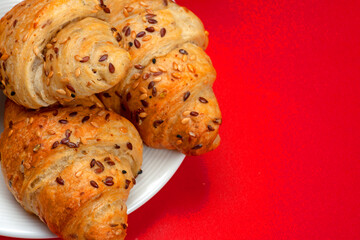 tasty croissants on the red table