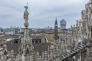 Spires on roof top of Milan Cathedral. Milan Cathedral (Duomo di Milano) dedicated to St Mary of the Nativity, with Gothic and Lombard Romanesque style. MILAN, ITALY. 