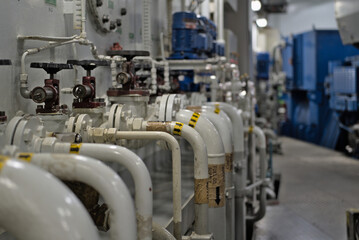 Industrial valves, pipes in modern offshore ship's engine room