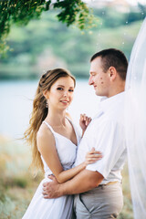 Obraz premium young couple a girl and a guy are walking in the field