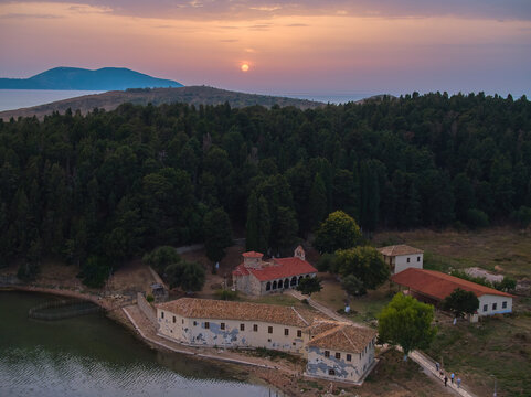 Aerial view of St. Mary's Monastery, Zv&euml;rnec and surroundings. Sunset, colorful sky. Panoramic aerial photography. Famous tourist place, Laguna Narte, Albania. 