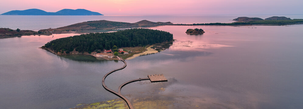 Aerial view of St. Mary's Monastery, Zv&euml;rnec and surroundings. Sunset, colorful sky. Panoramic aerial photography. Famous tourist place, Laguna Narte, Albania. 