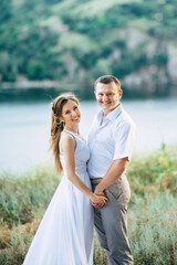 Fototapeta premium young couple a girl and a guy are walking in the field