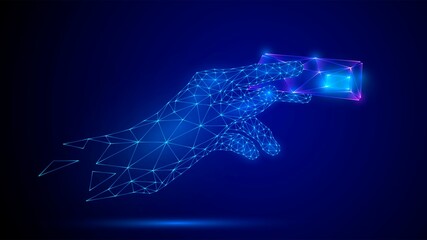 Made from glowing blue triangular polygonal mesh hand holding a bank card