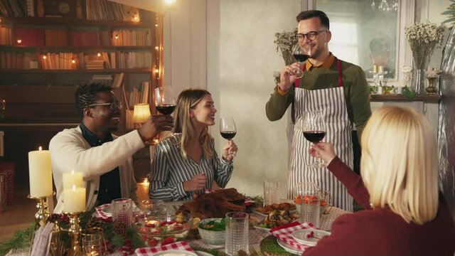 Friends having lunch together at a table during Christmastime