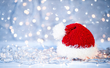 santa claus hat on christmas light background