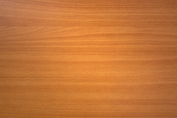 The texture of the wooden countertop is yellow with horizontal stripes of dark color. Wooden background for text.