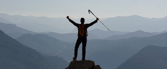 person on top of the mountain