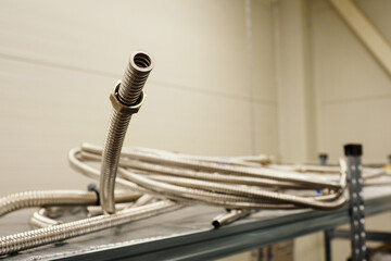 Metal stainless steel flexible pipe with nut.
