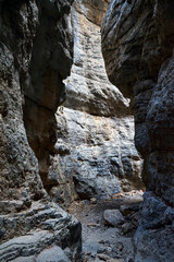 A narrow passage between the rocks of the Imbros Gorge on the island of Crete