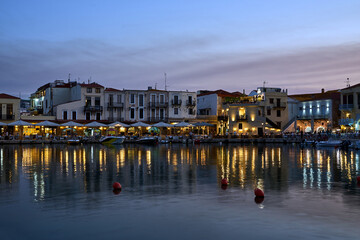 Taverns in the port of Rethymno city in the evening on the island of Crete