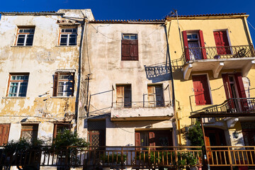 Fototapeta na wymiar Facades of historic townhouses in the town of Chania on the island of Crete
