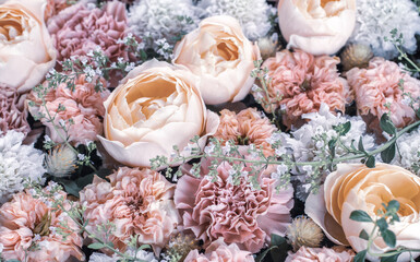 Flower arrangement in retro colors. Roses and carnations.