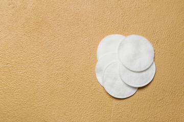 Clean soft cotton pads on color background